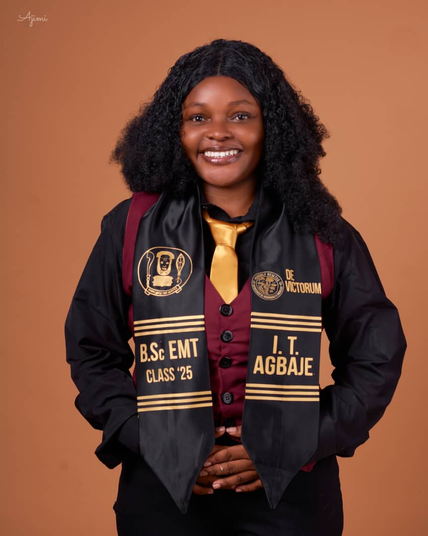 Close-up of a person wearing orange-tinted goggles and a dark head covering with motion blur effect on an orange background.